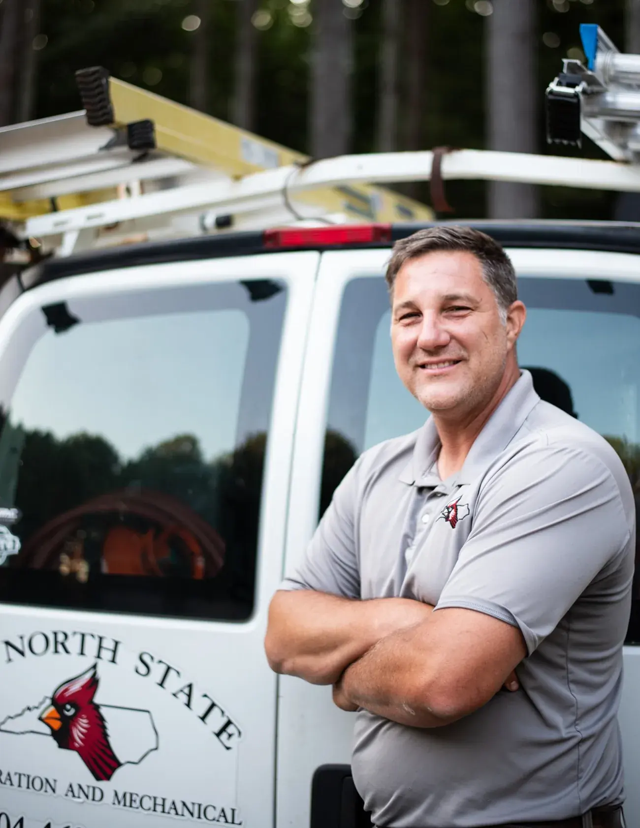 Turner Beam, Owner and Operator of Old North State HVAC, beside his service van in Cherryville NC